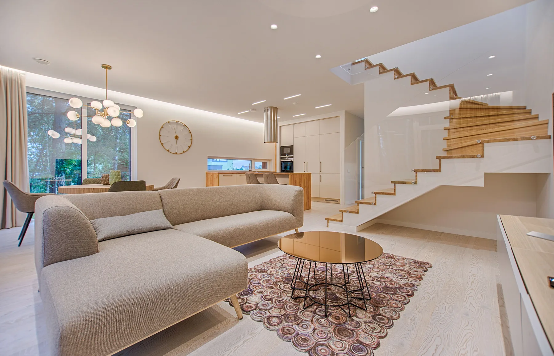 Representative modern living room interior with warm wood and neutral furnishings